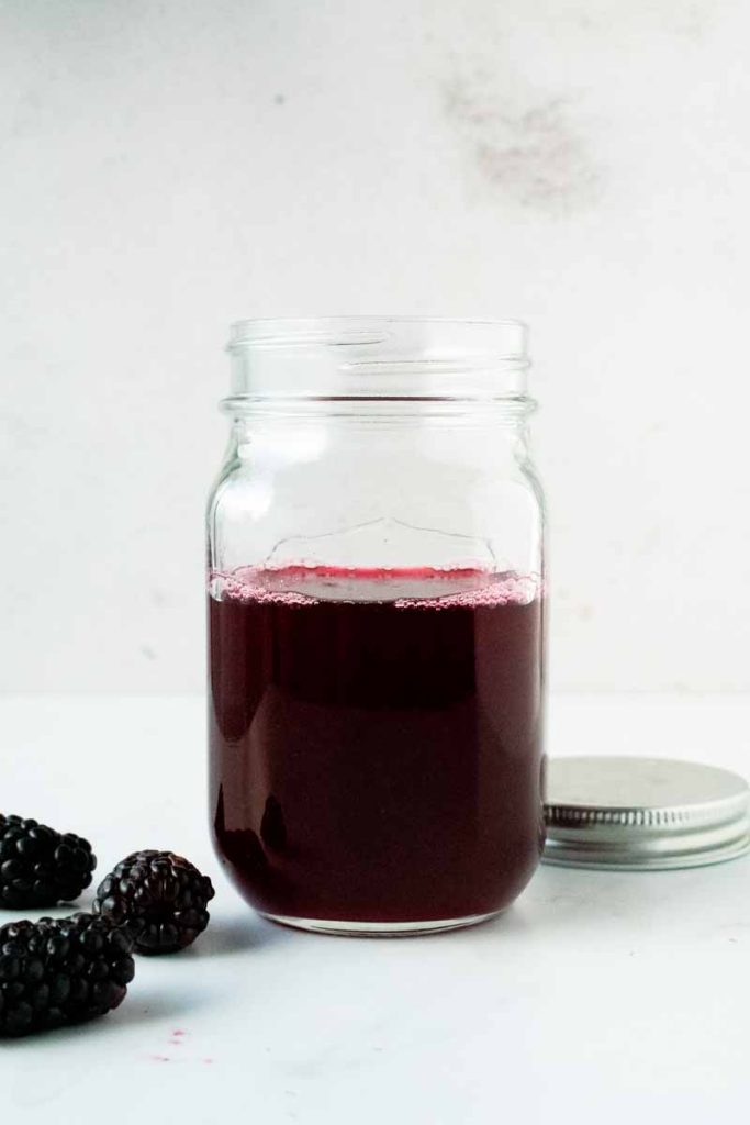 blackberry simple syrup in a jar 