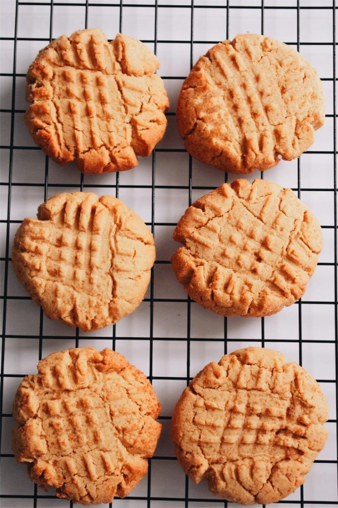 freshly baked peanut butter cookies on cooling rack
