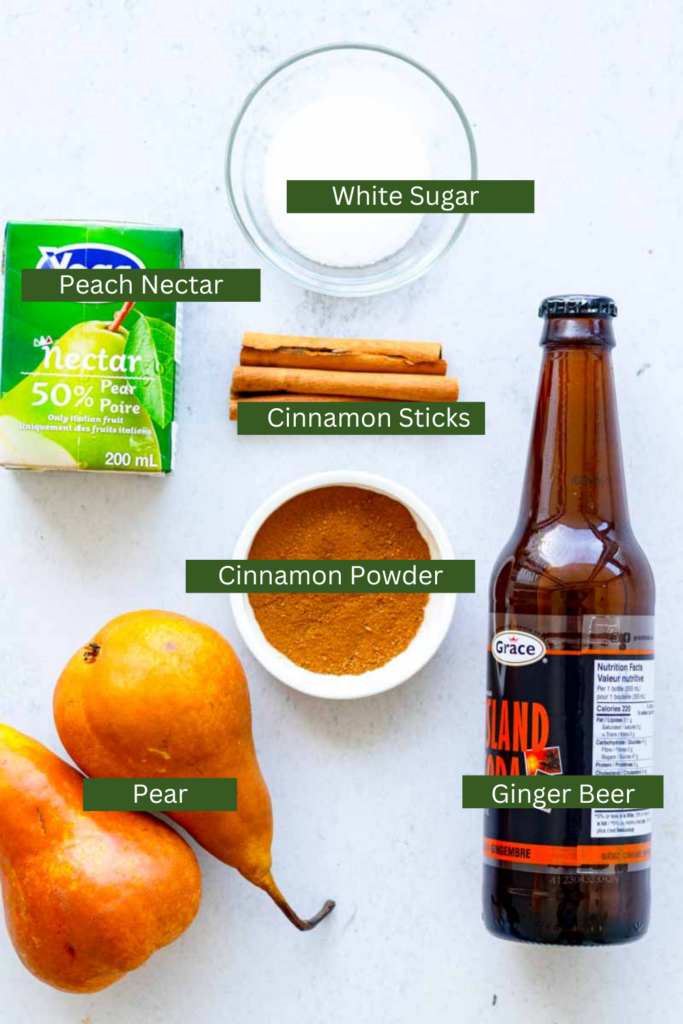 pear, cinnamon powder, cinnamon sticks, ginger beer, peach nectar and white sugar on table top