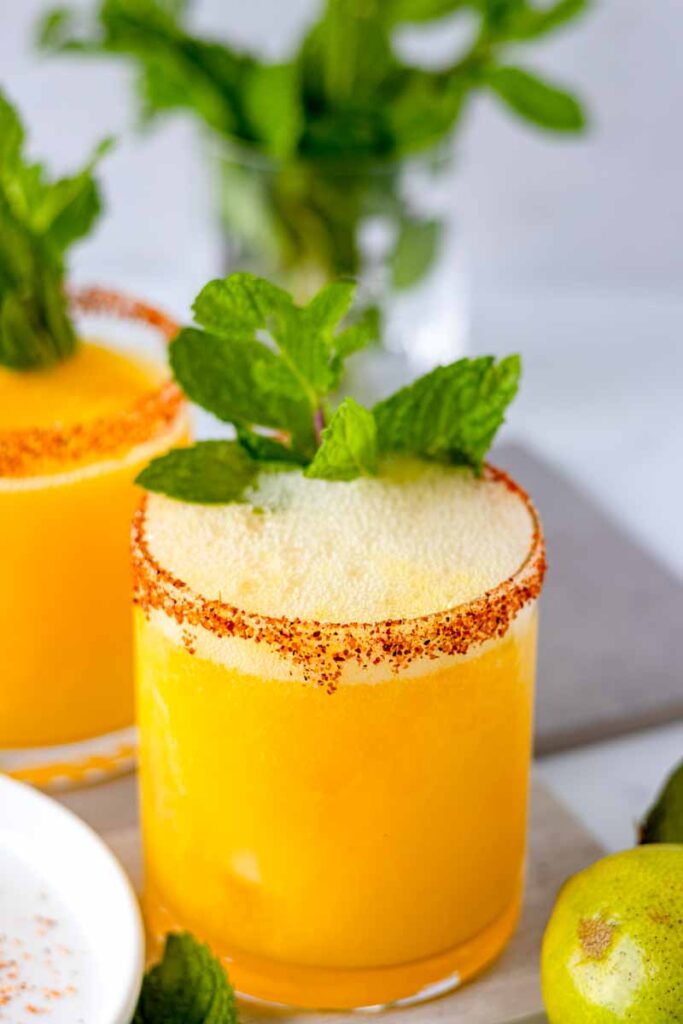 fizzy mango mule with mint leaves places on a table