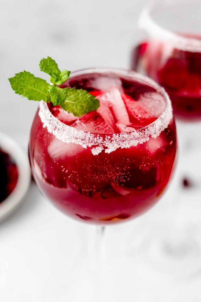 a glass of cranberry mocktail
