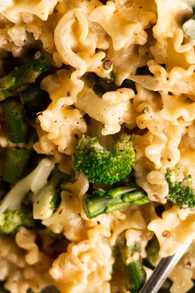 broccoli asparagus pasta in a green plate
