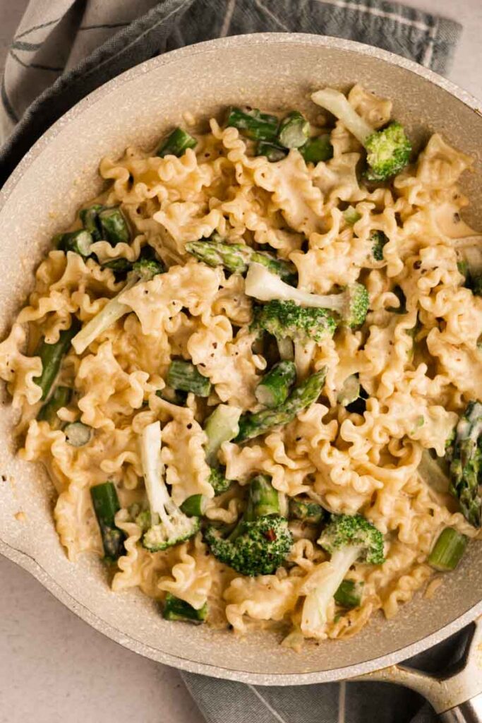broccoli asparagus pasta in a skillet