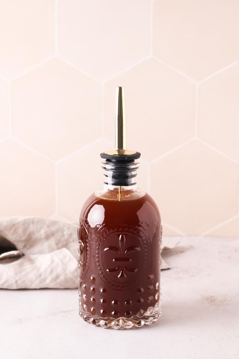 brown sugar cinnamon syrup in syrup bottle and tan napkin
