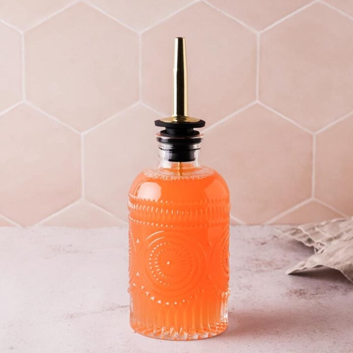 fresh grapefruit syrup in a bottle with nozzle