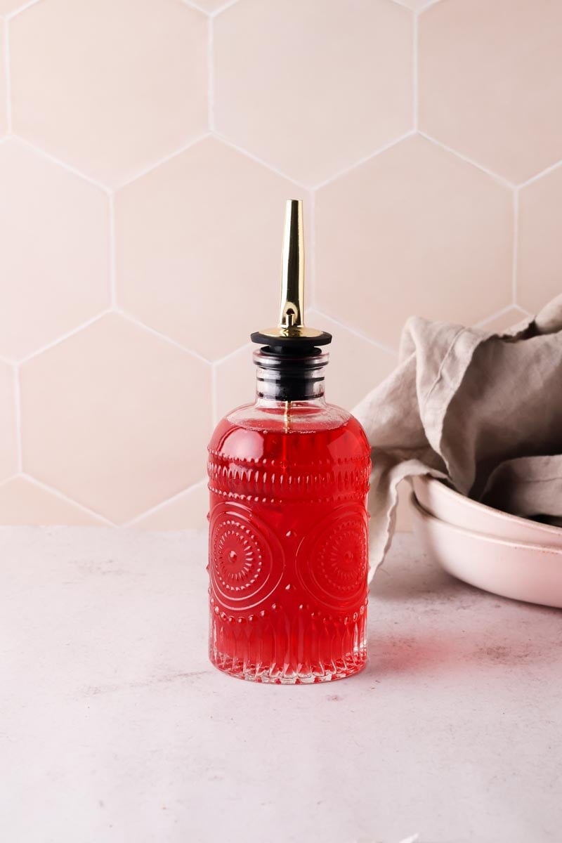 raspberry syrup in a syrup bottle